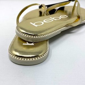 Women's bebe 𝐈𝐥𝐞𝐚𝐧𝐚 Gold  thong sandals